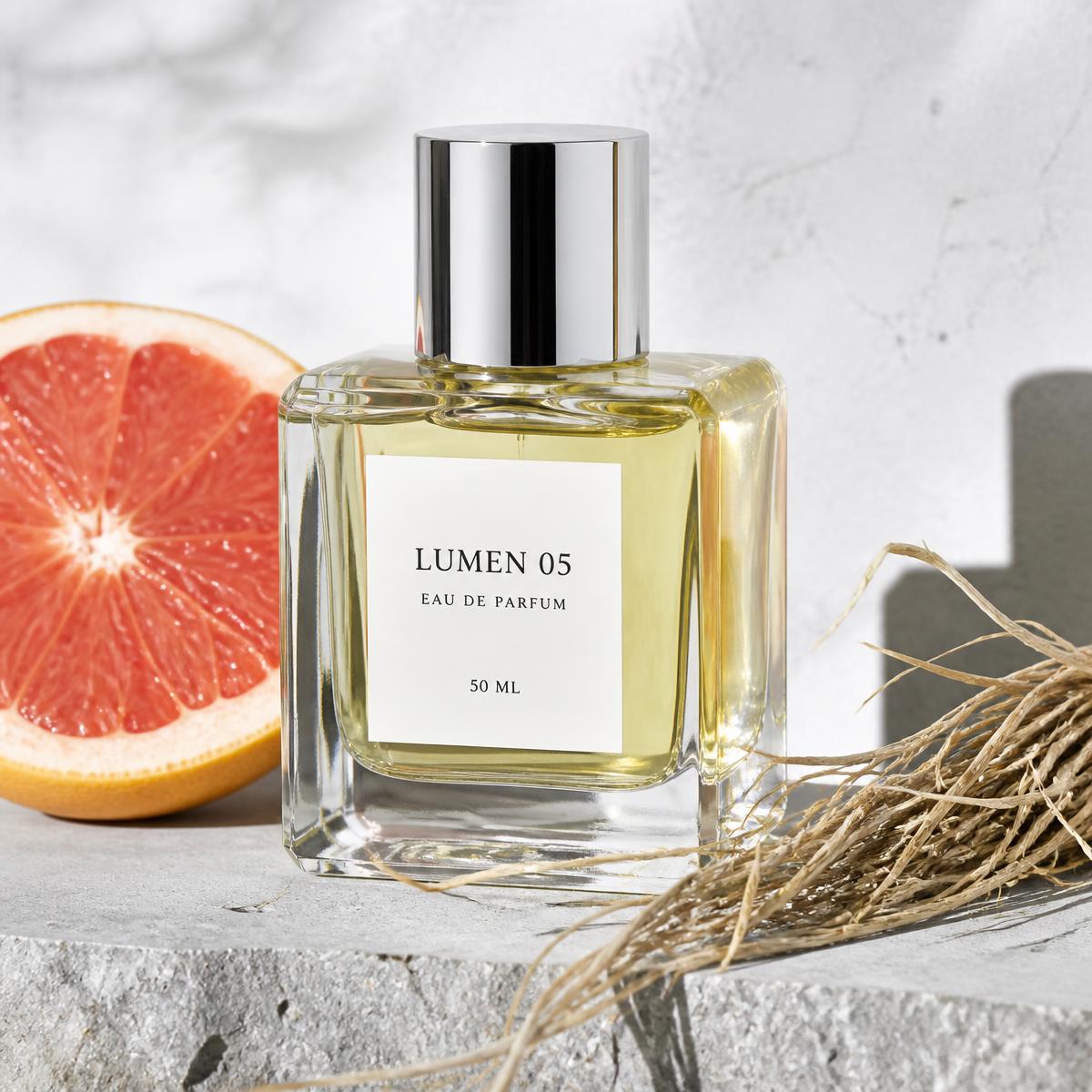 A pale, minimal eau de parfum bottle on a desk surface