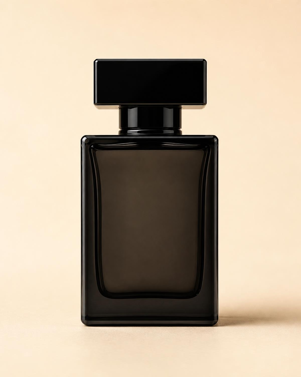 A dark, warm-toned editorial fragrance image shot in low light